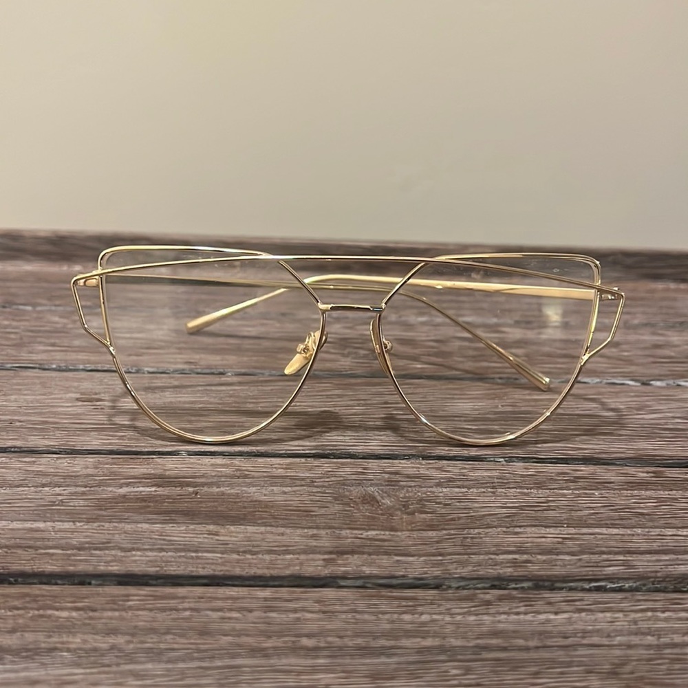 Clear lens gold frame glasses